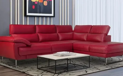 Modern red leather L-shaped sofa in Dubai living room.
