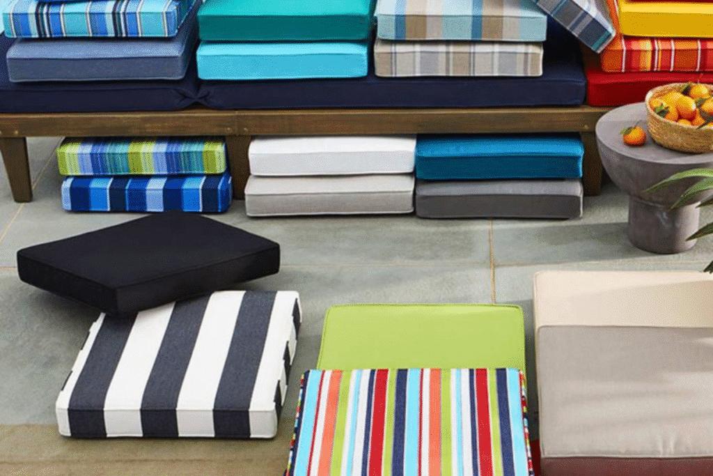 Colorful outdoor seat cushions stacked and arranged on patio