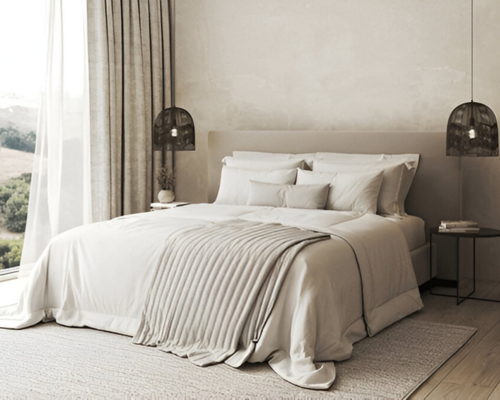 Minimalist bedroom with neutral bedding, large window, and modern pendant lights